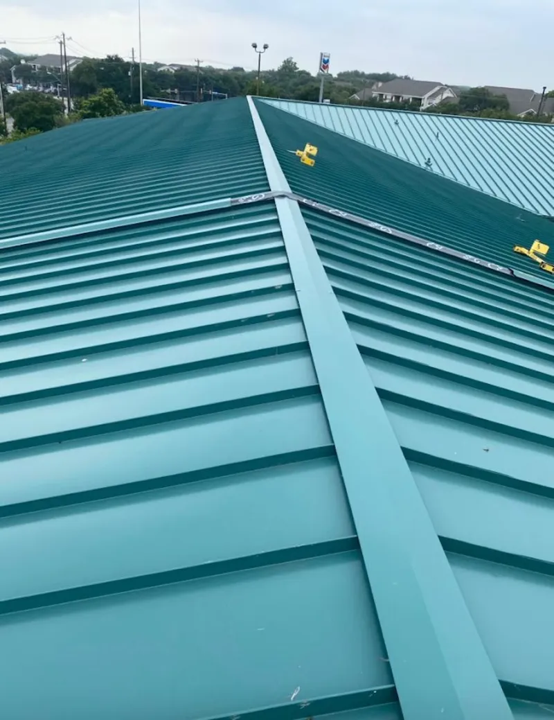 Green commercial metal roof ridge and valley for Metal Roof Repair in El Paso